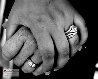 Bride and groom hold hands