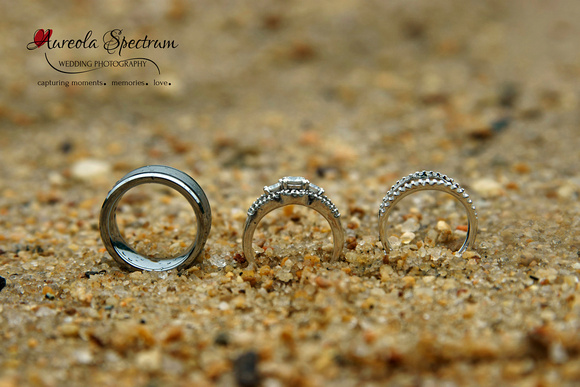 Macro of wedding rings on the beach