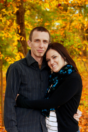 Engaged couple pose in fall color in October