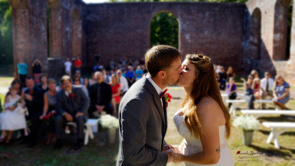 bride and groom share first kiss at St. Philip's Church
