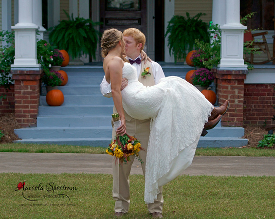 Groom holds bride in Monroe, NC wedding