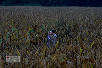 Epic engagement photo of couple kissing in corn field