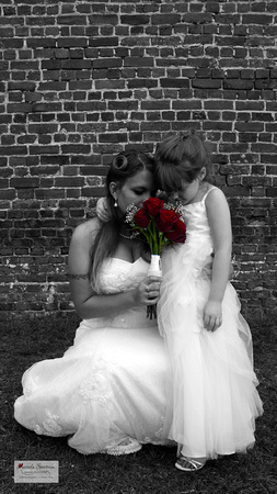 Smell the roses - bride and flower girl