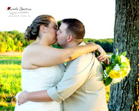 Bride and groom kiss in Concord, NC field.