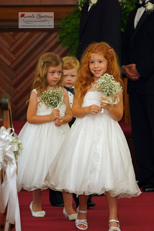 Flower girls and ring bearer exit the ceremony.