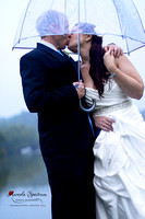 Bride and Groom kissing in the rain in Lake Lure, NC.