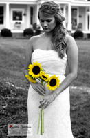 Beautiful bride holds sunflowers