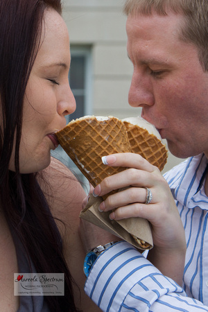 Engaged couple enjoys an ice cream treat.