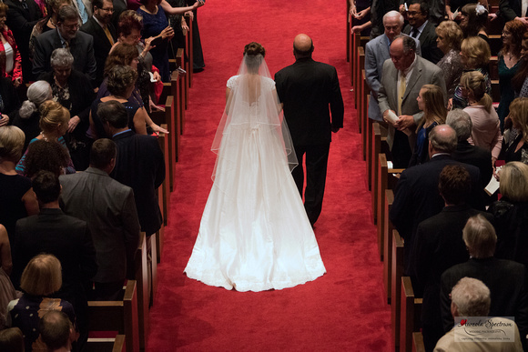 Bride and her dad walk down the aisle at her Greensboro, NC wedding.