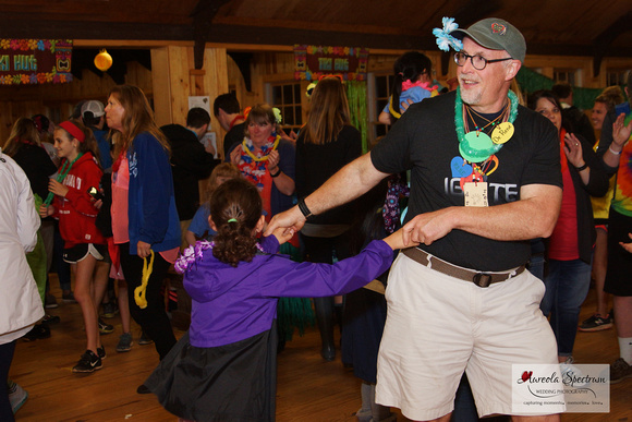 Dr. Rene dances with one of the heart kids