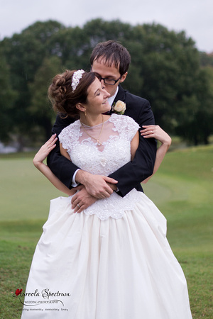 Bride and groom snuggle at Starmount Forest Country Club.