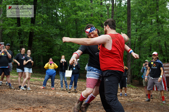 Volunteers mud wrestle at camp luck family camp 2016.