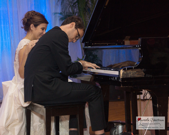 Groom plays the piano for his bride and guests in Greensboro, NC.