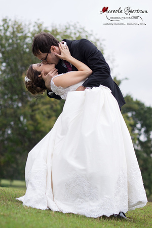 Bride and groom kiss and dip at a Greensboro, NC golf course.
