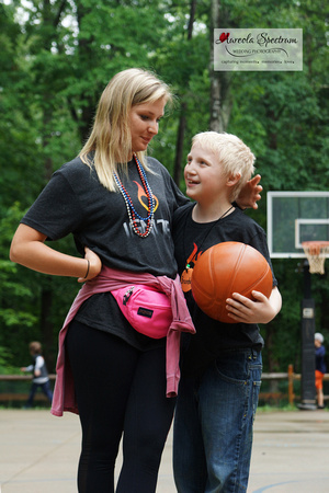 volunteer and heart kid bond at camp luck