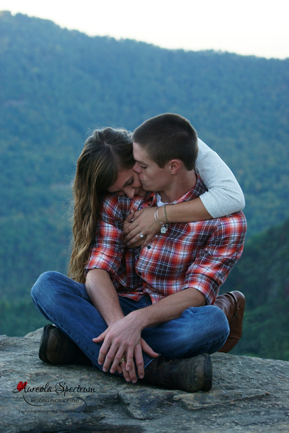 Couple snuggles in Chimney Rock, NC