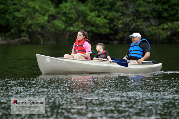 Heart family in canoe during camp luck.