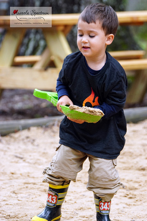 Kid plays in sand at camp luck family camp 2016.
