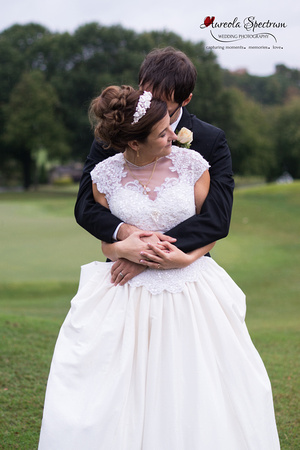 Bride and groom pose on golf course in Greensboro, NC.