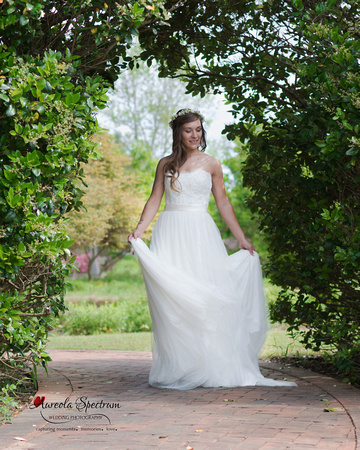 Bride turns side to side in wedding dress in Belmont, NC.